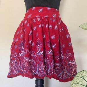 Beautiful, red skirt with designs and POCKETS. Size L